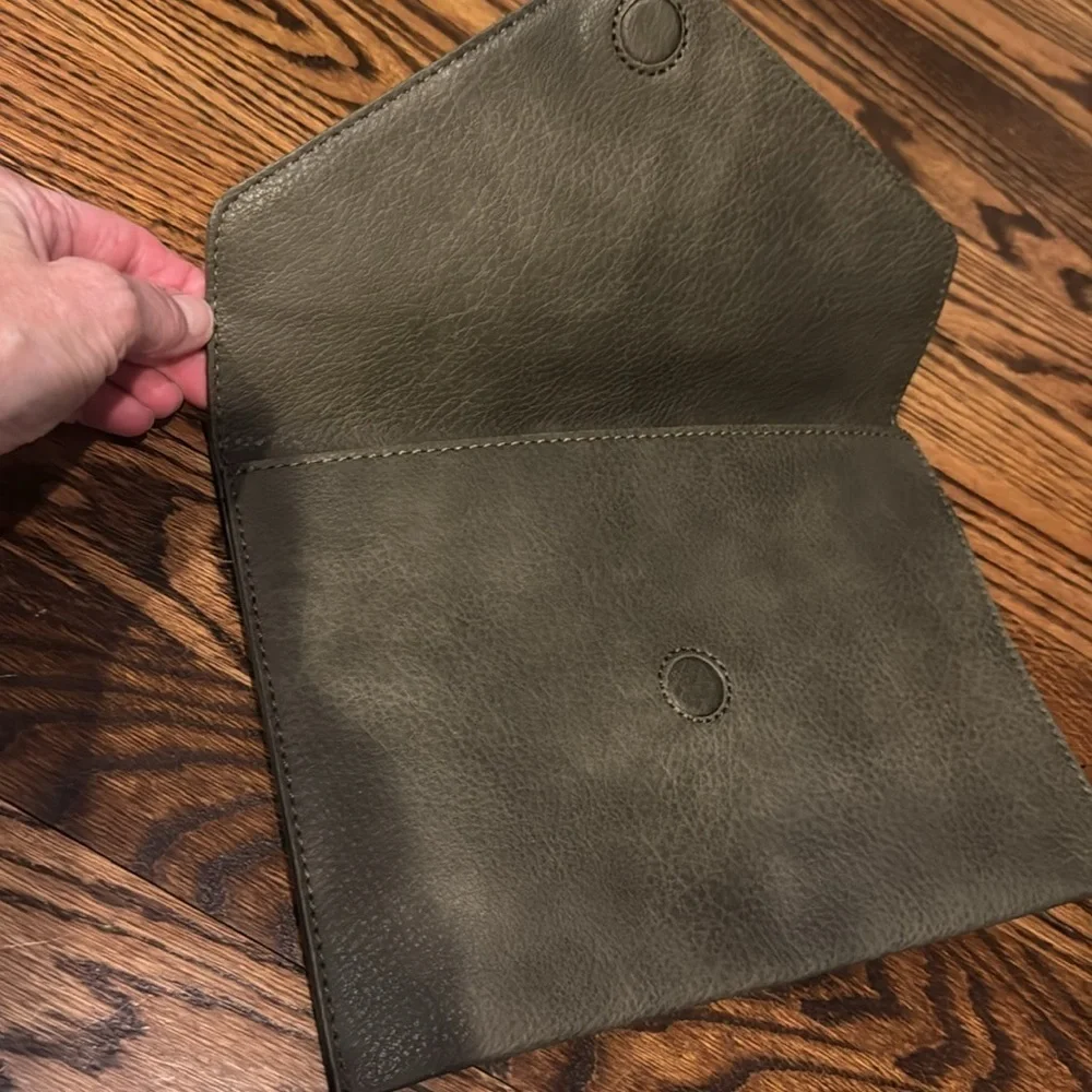 Anthropologie Street Level faux pebbled leather olive tasseled envelope clutch.